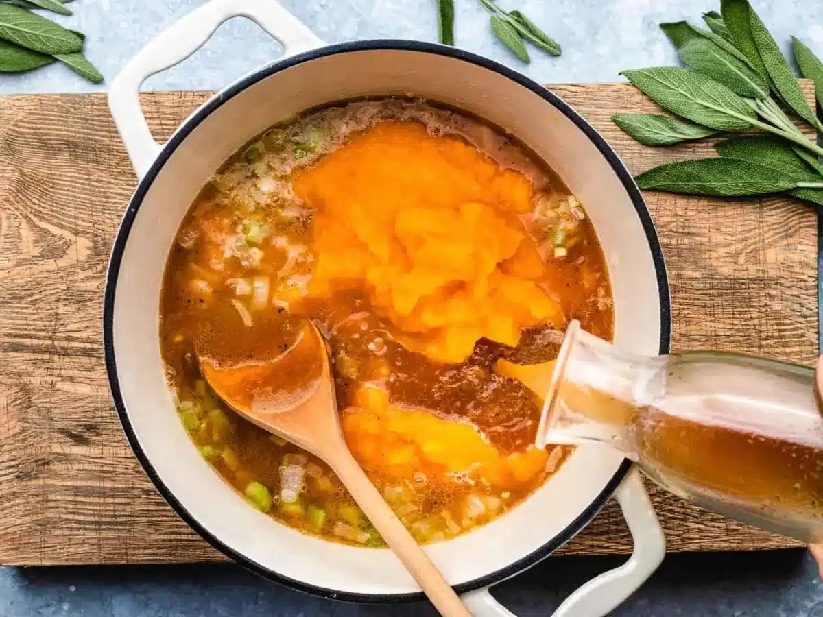 more ingredients being added to the soup 