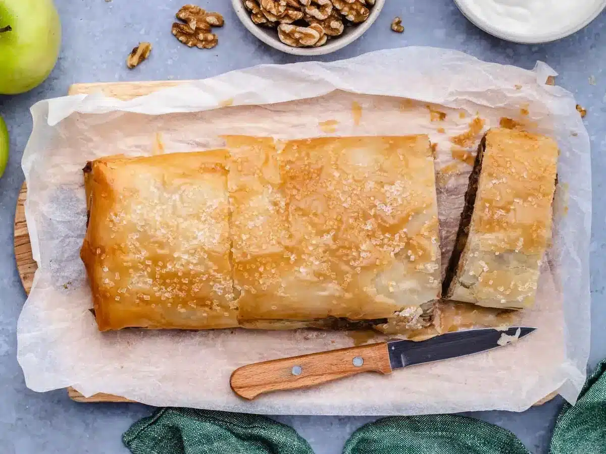 finished pastry with slices being cut