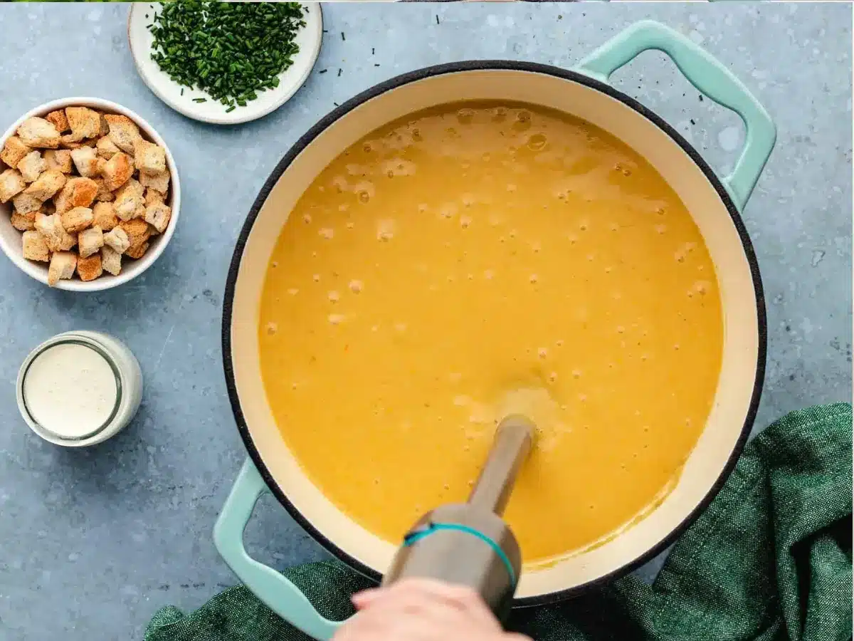 blending the soup up with a blender 