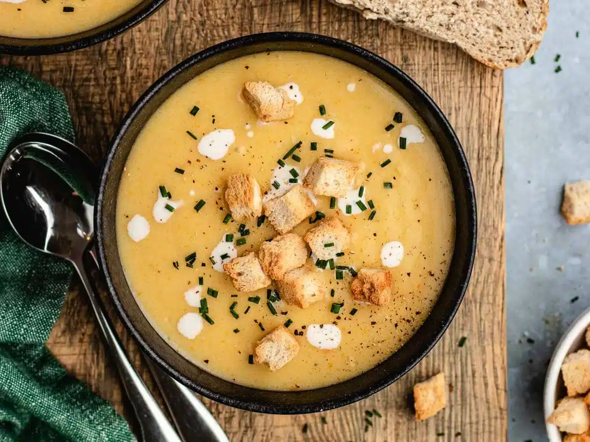 bowl of potato soup with toppings 