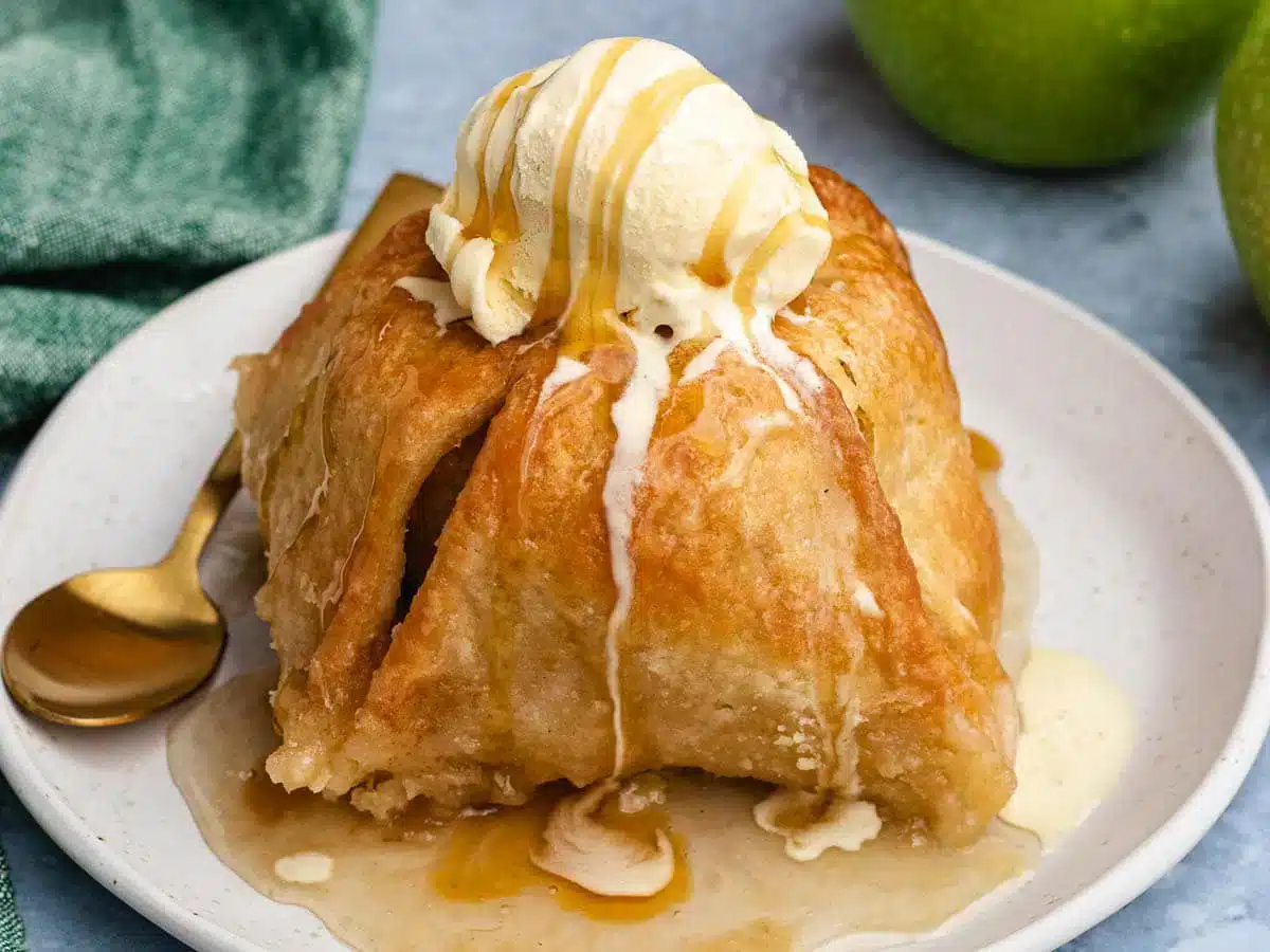 dumpling on a plate topped with ice cream 