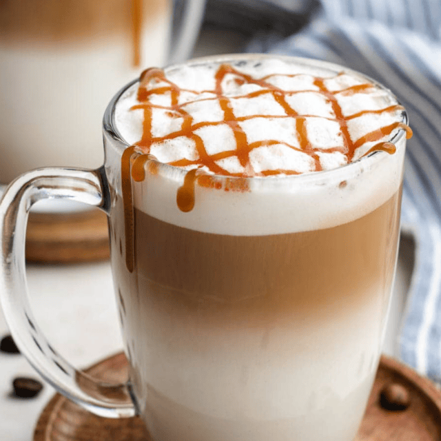 Clear glass with coffee, milk and caramel drizzle