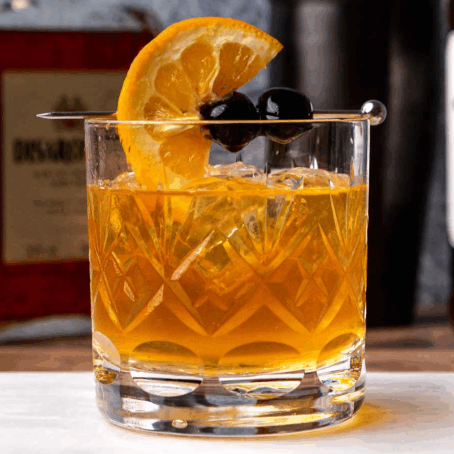 Rocks glass with mixed drink and garnish.