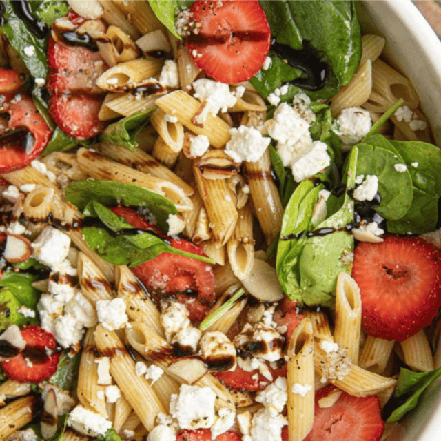salad in bowl mixed with dressing
