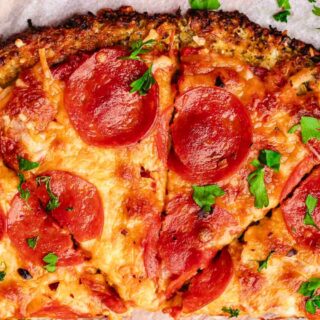 Photo of sliced pizza pie with pepperoni topping
