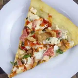 top down view of a pizza on a white plate