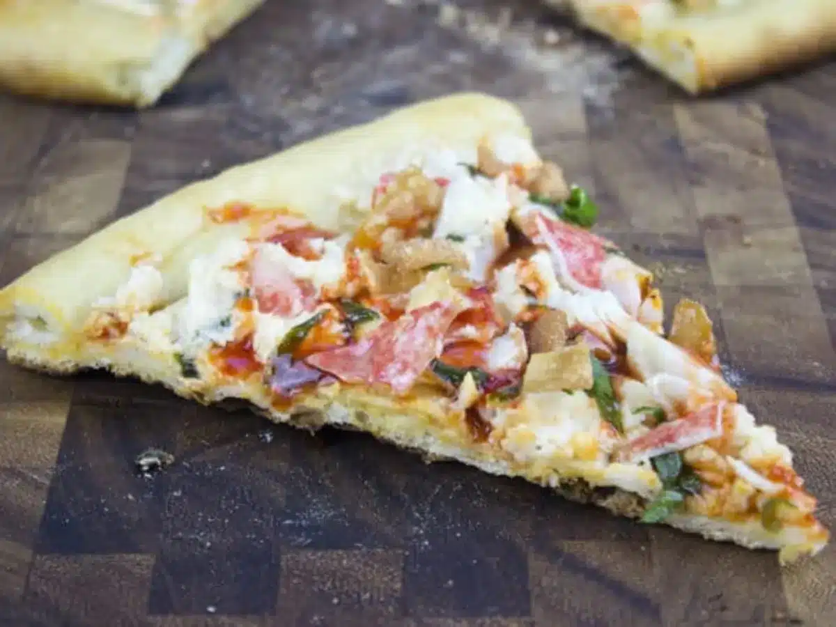 side view of pizza on a butcher block