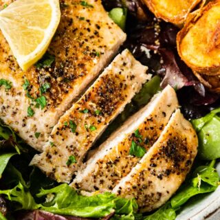 Seasoned chicken served over salad 4x3