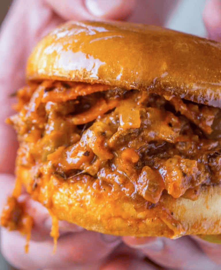 Close up of meat sandwich being held