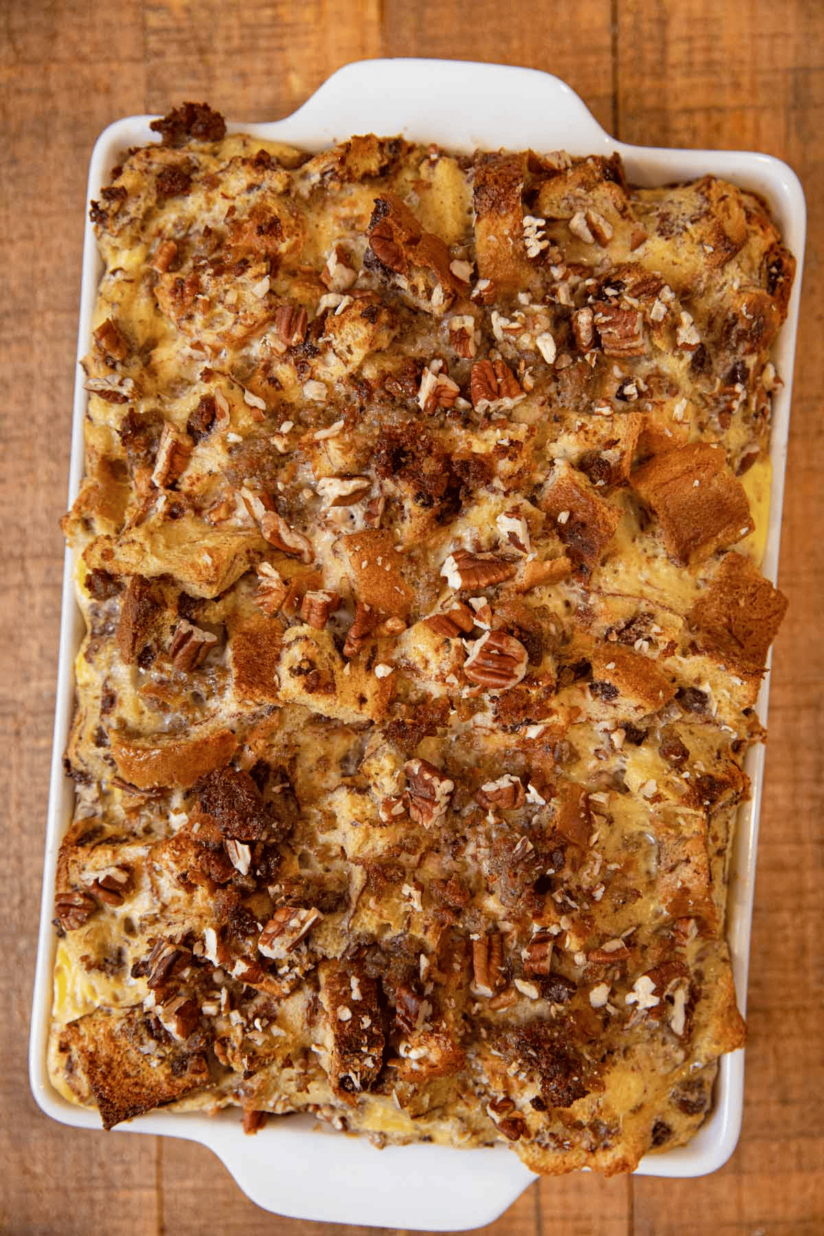 Bread bake topped in pecans in a baking dish