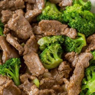 Close up of cooked beef pieces and broccoli in sauce