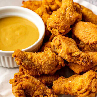 Appetizer plate with sauce and chicken wings