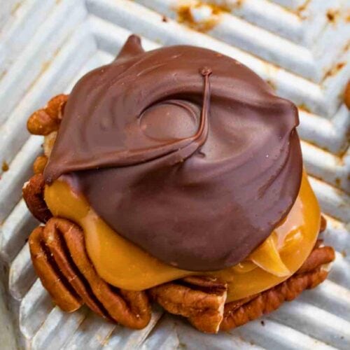 Homemade chocolate and caramel candy on a metal baking sheet