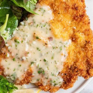Bold and bright sauce on fried chicken cutlet.