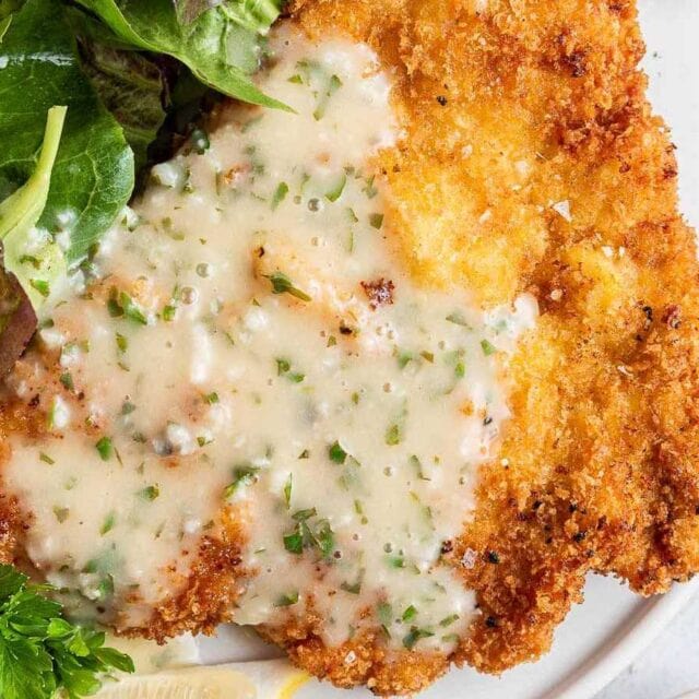 Bold and bright sauce on fried chicken cutlet.