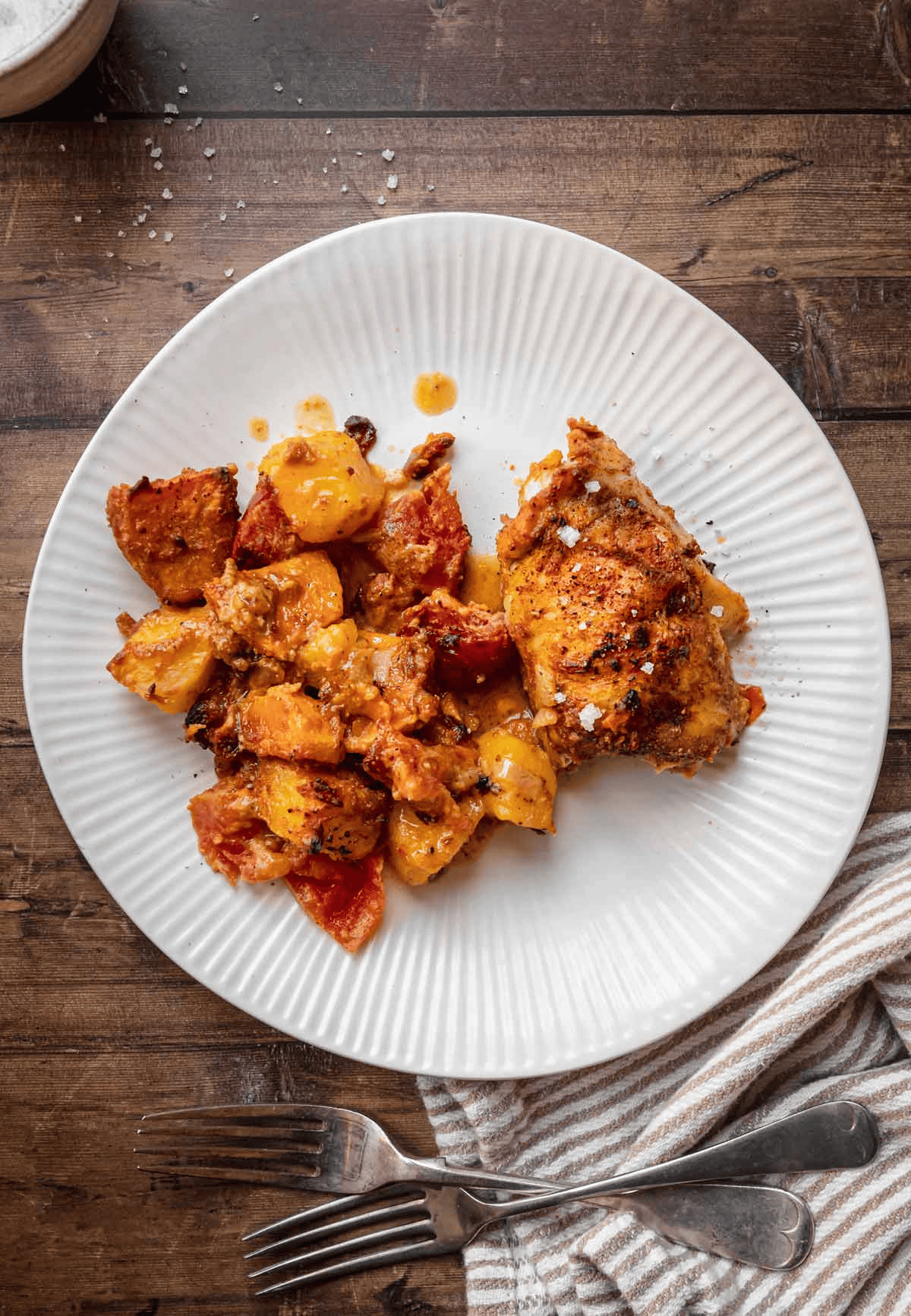 African chicken dish shown from above on a white plate