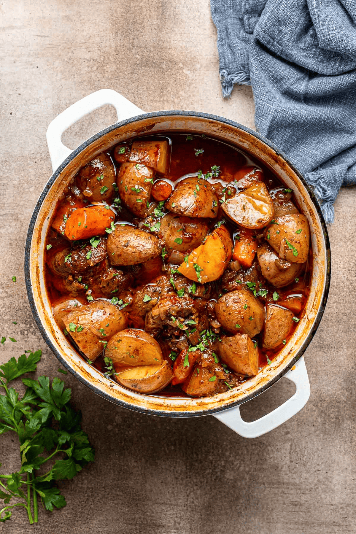 Cooked lamb, potatoes, vegetables in broth