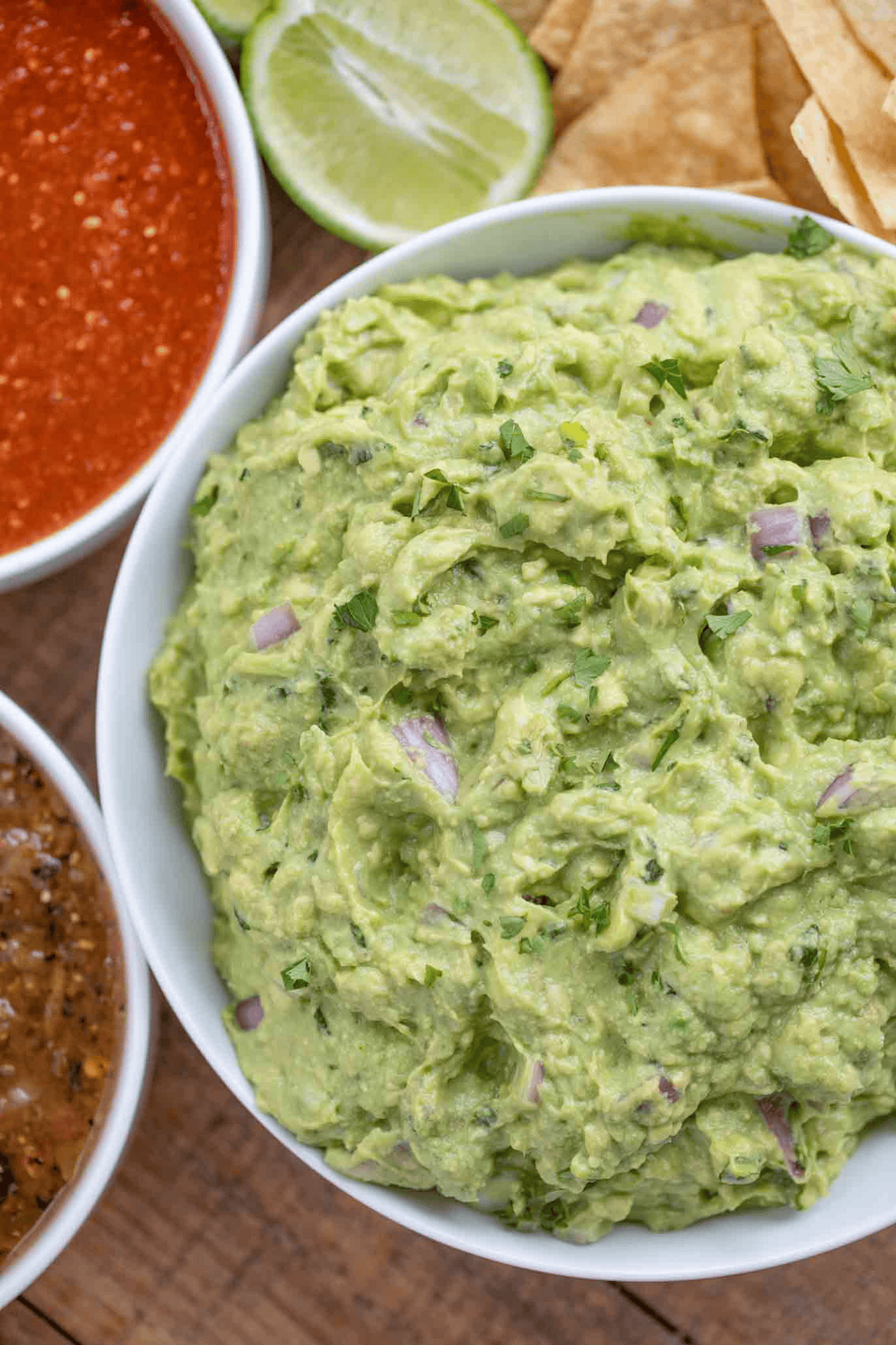 Creamy guacamole with other sauces on the side