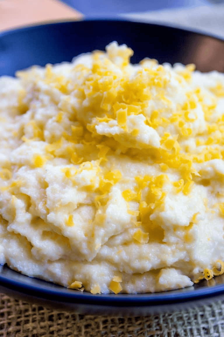Close up view of cheesy polenta in a bowl