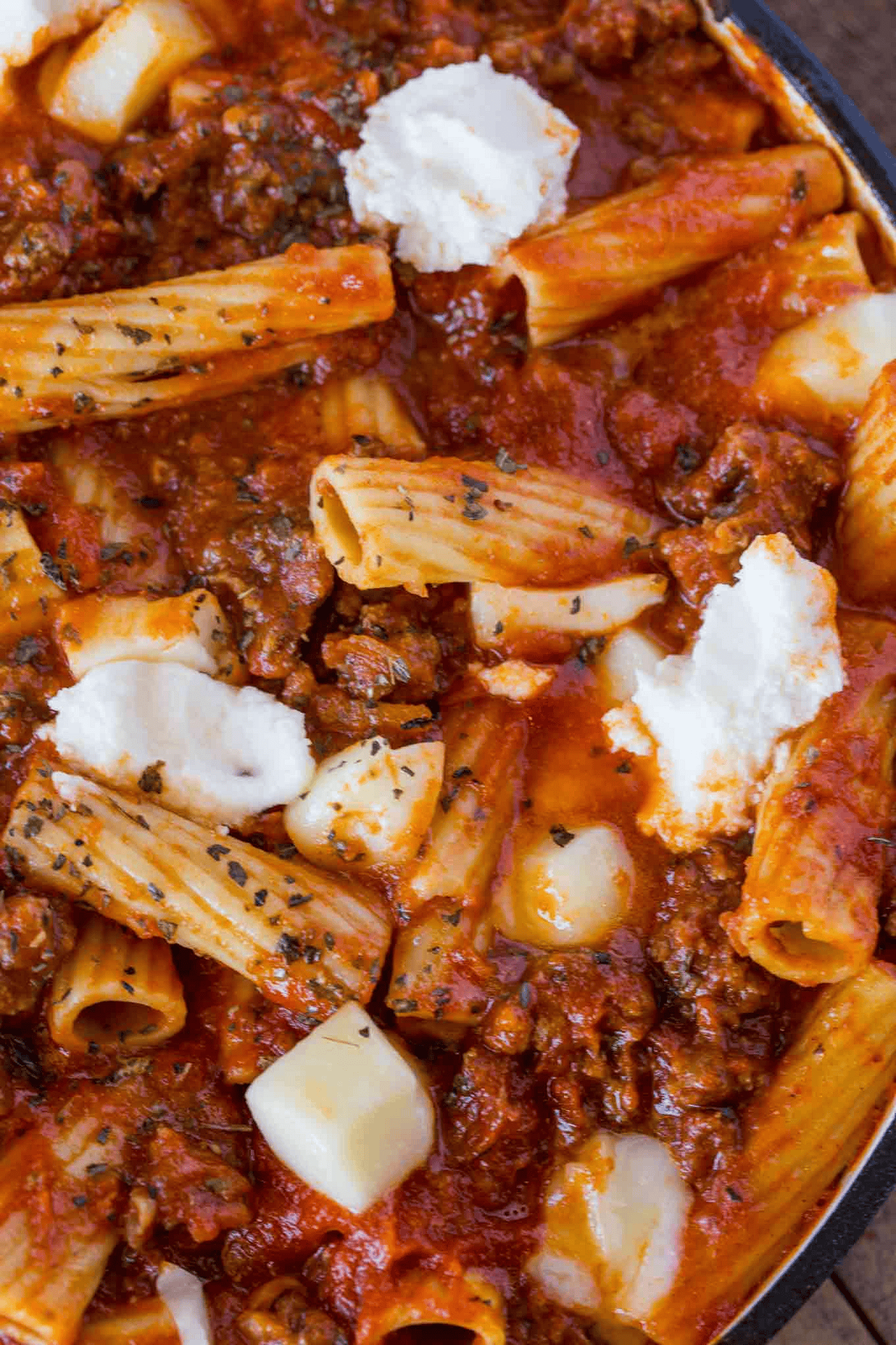 Close up of pasta dish with cheese and sauce