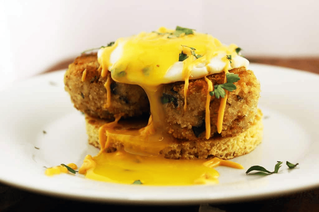 Crab cake on top of a pancake topped with an egg