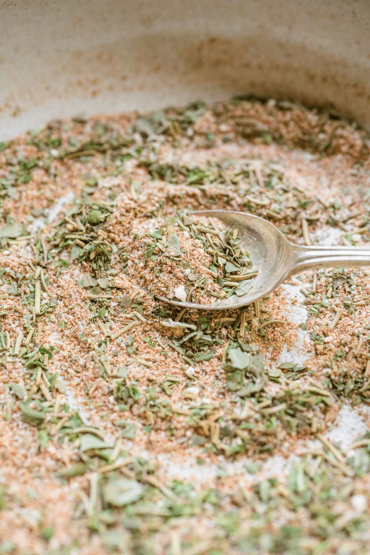 Seasoning blend being mixed with a spoon
