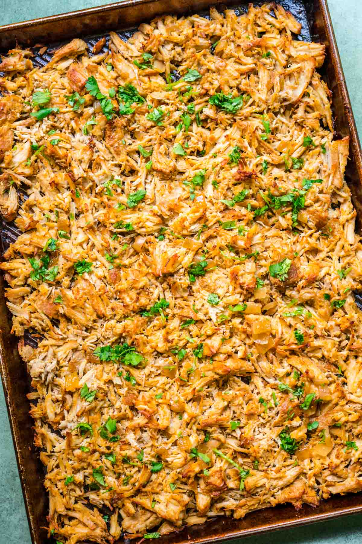 shredded pork on a baking tray