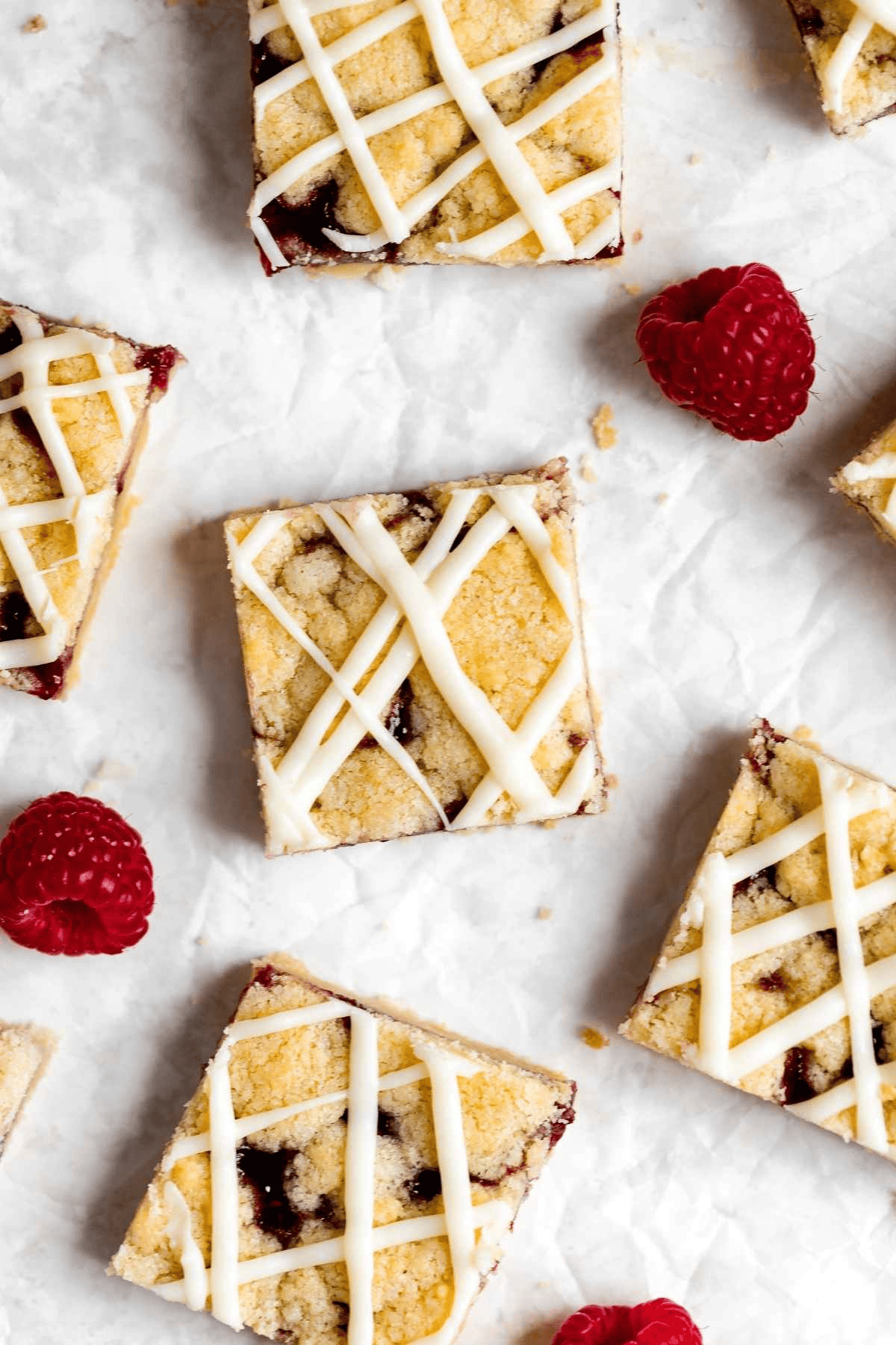 Dessert squares with white chocolate drizzled over top
