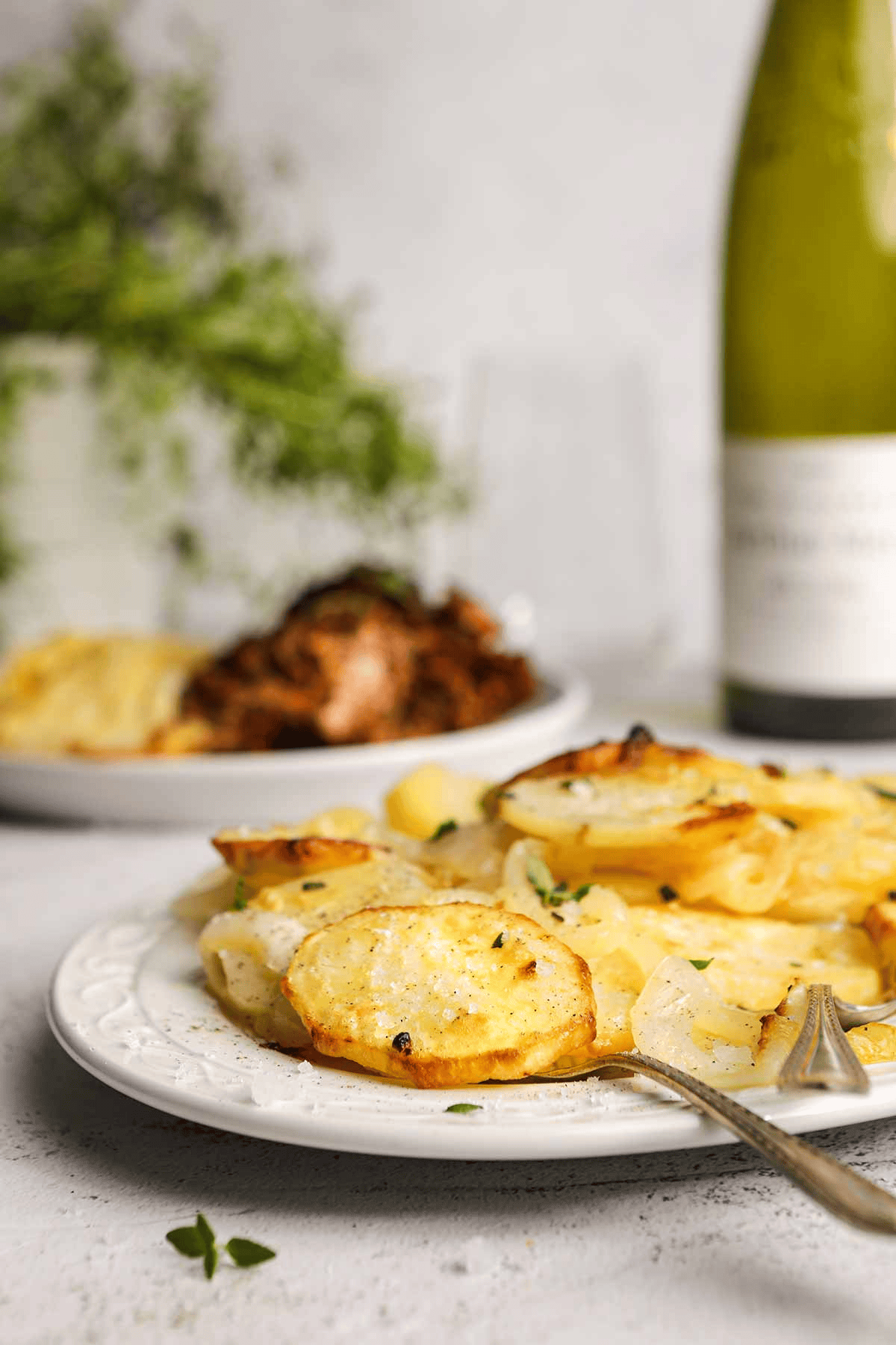 Potato dish on a serving platter from the side