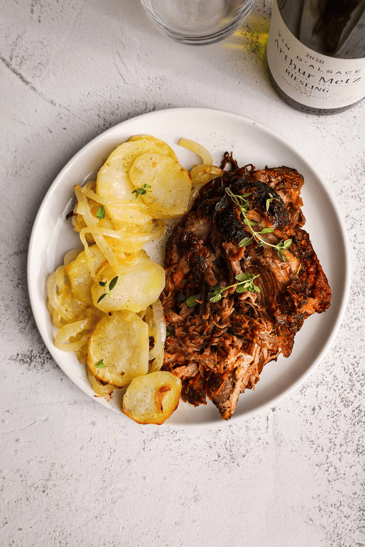 White plate with meat and potatoes