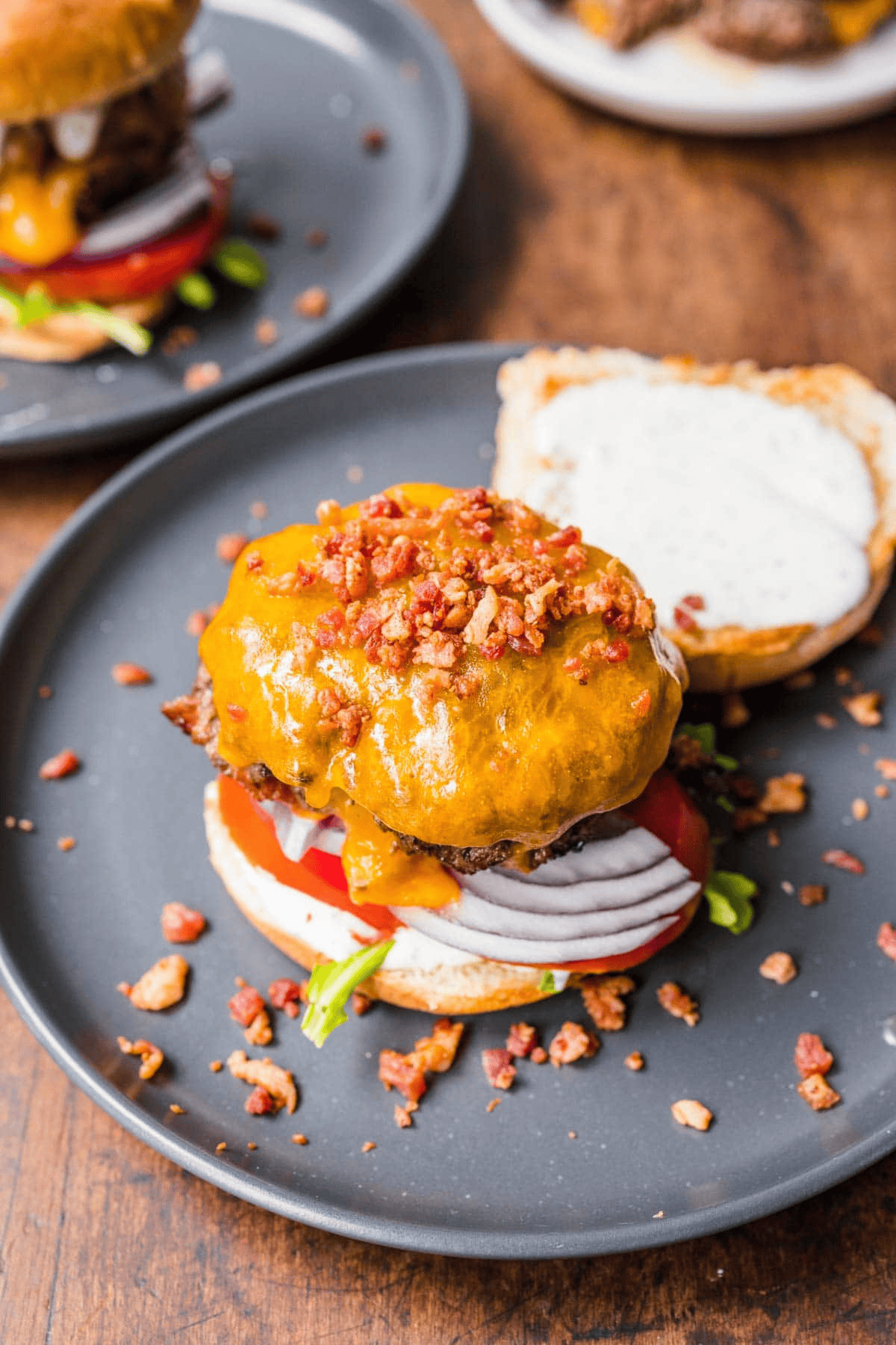 Open burger with bacon bits