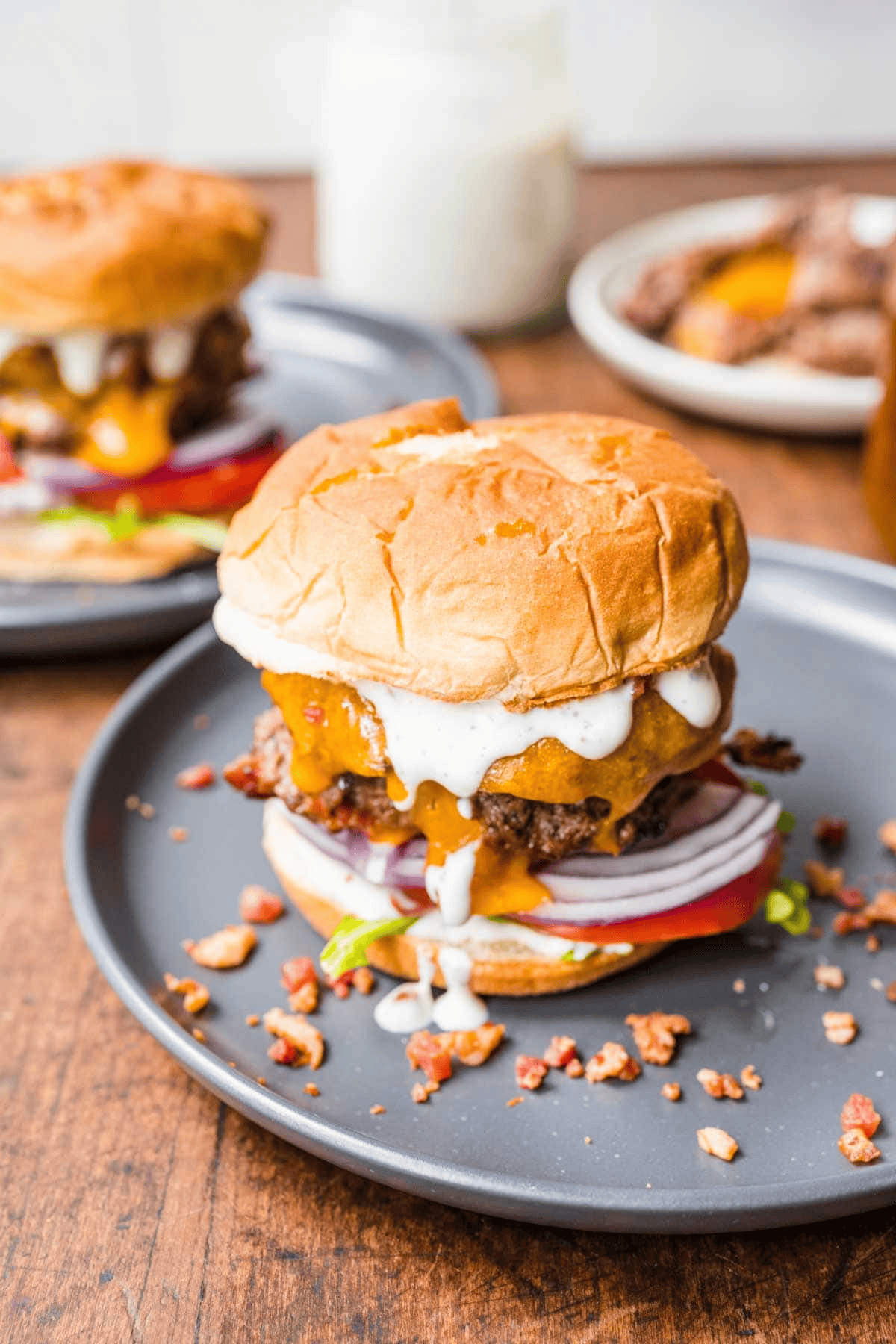 bacon cheeseburger assembled with fillings on a plate