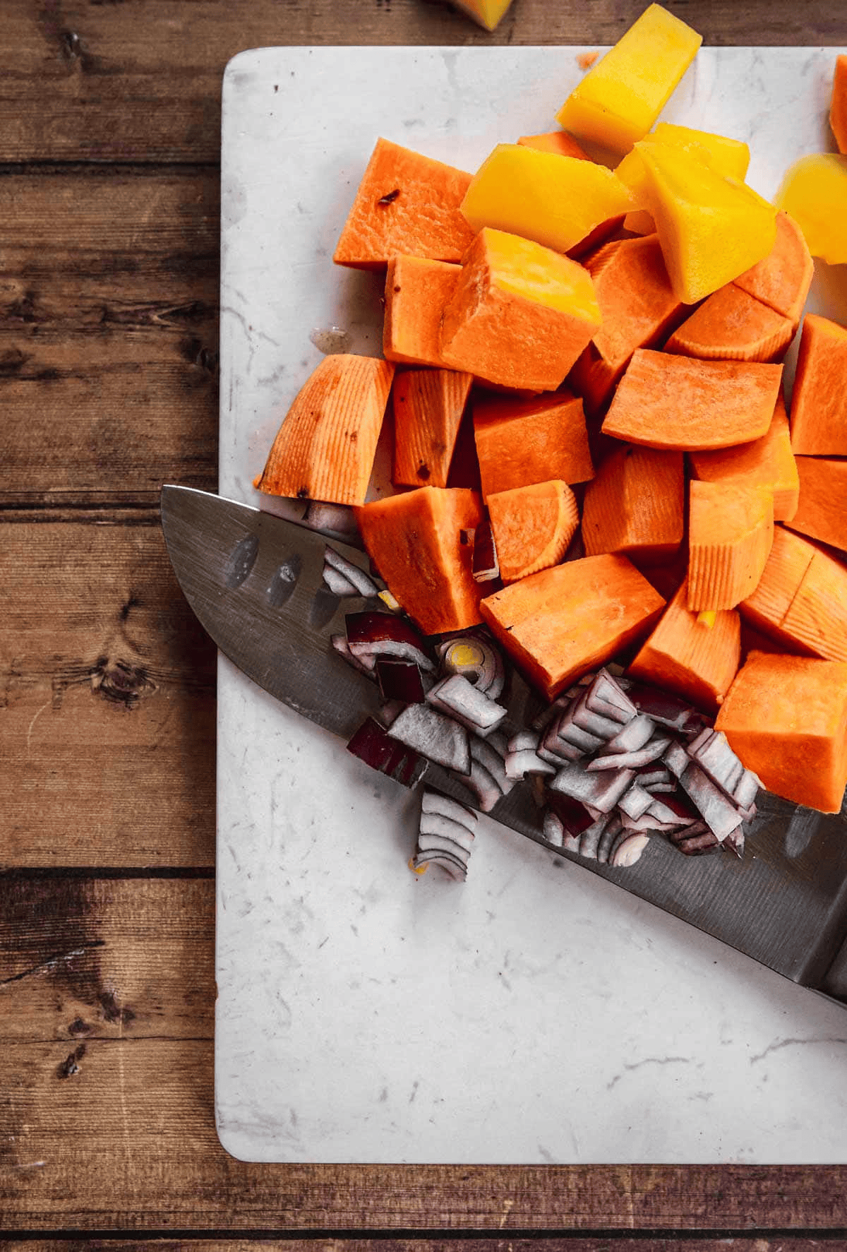Chopped sweet potatoes, red onions, and mangoes 