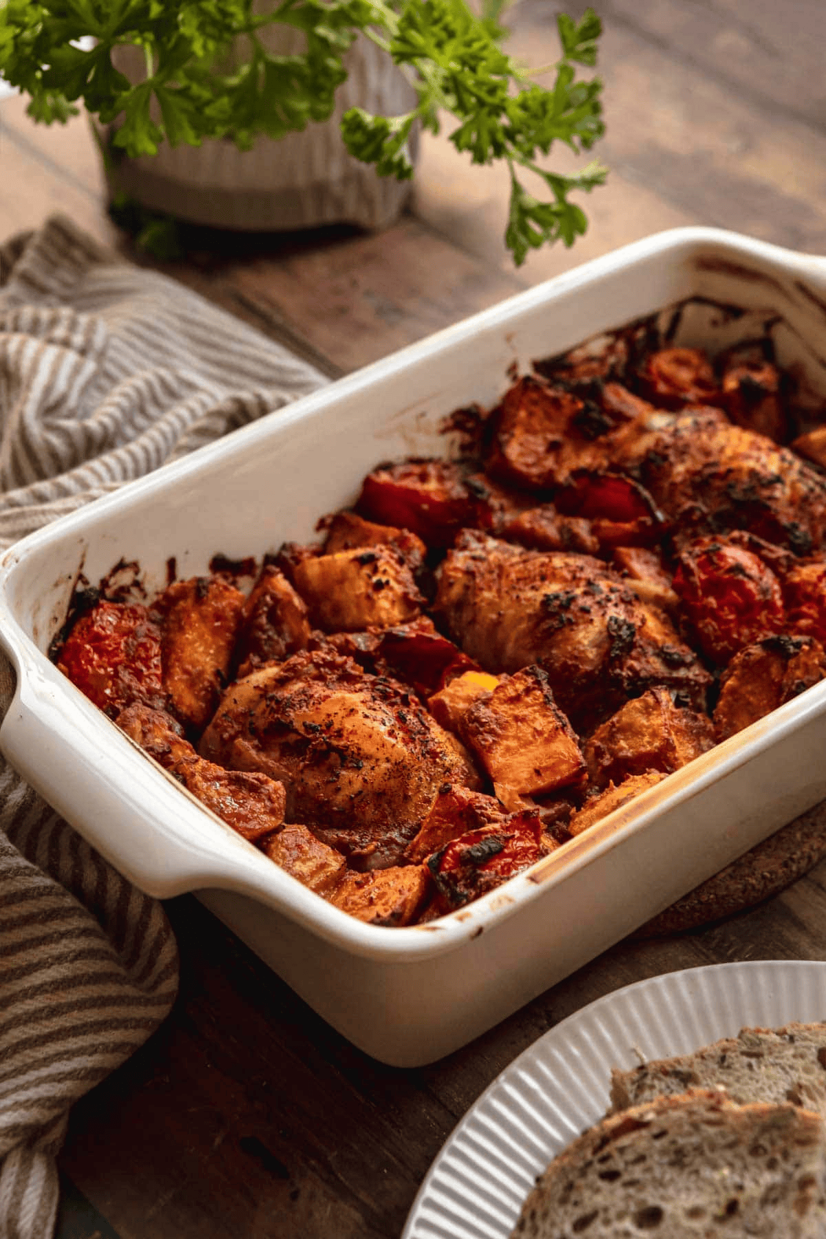 White dish of chicken and sweet potatoes