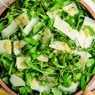 Prepared salad in a wood bowl.