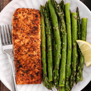Plated asparagus with salmon fillet