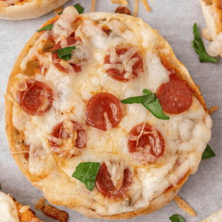 Round bread topped with cheese, pepperoni and herbs.