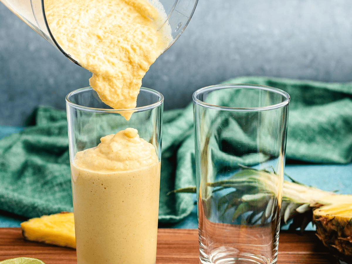 Smoothie being poured into glasses.