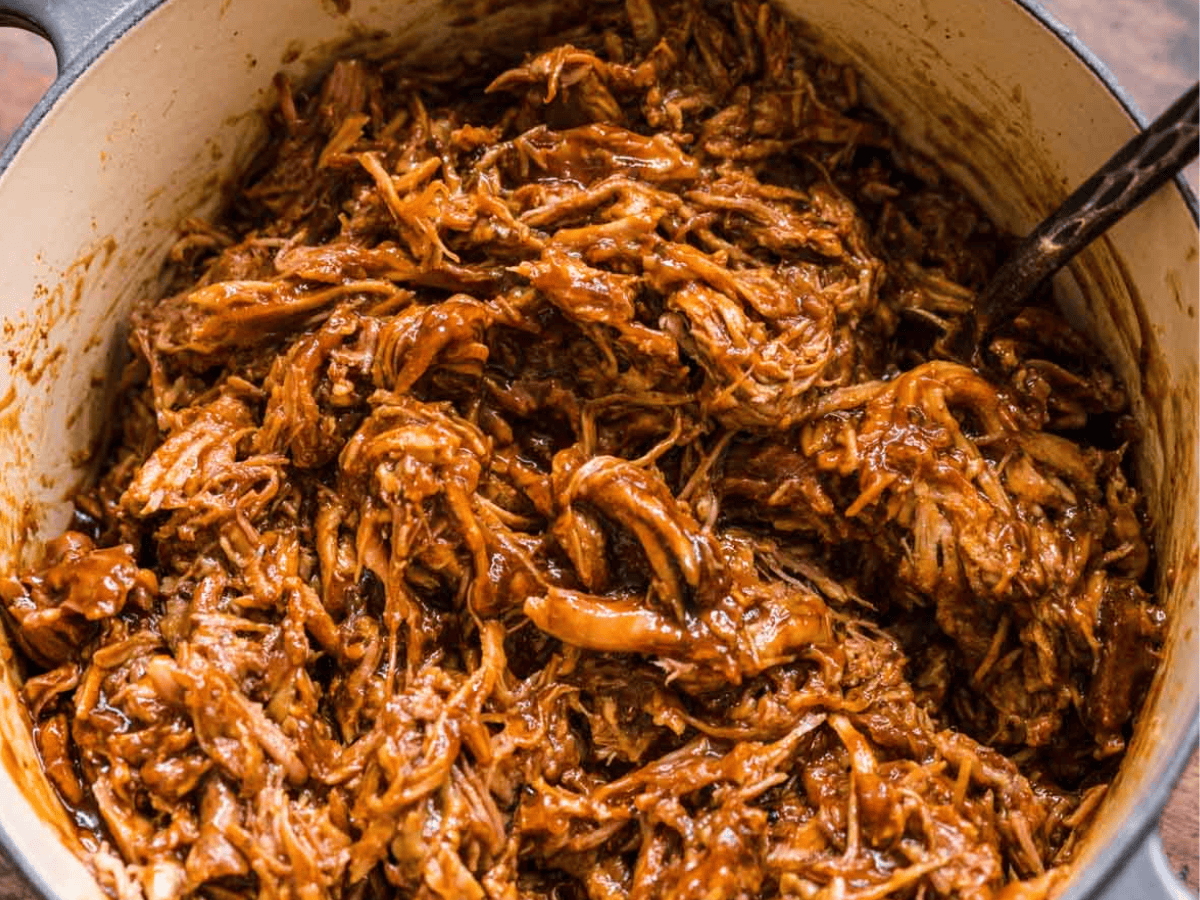 Shredded and seasoned pork in pot.