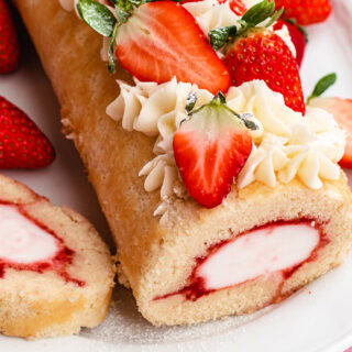 Cake roll with ice cream filling and strawberries.