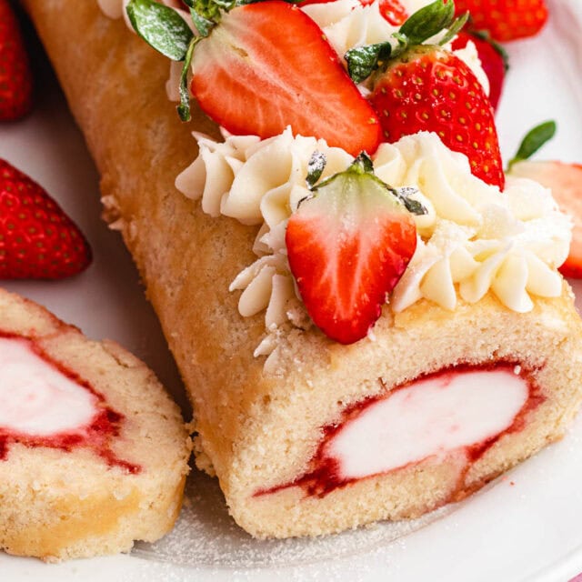 Cake roll with ice cream filling and strawberries.