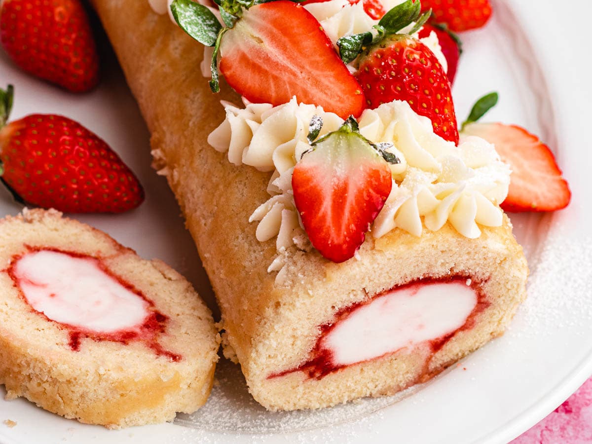 Cake roll with ice cream filling and strawberries.
