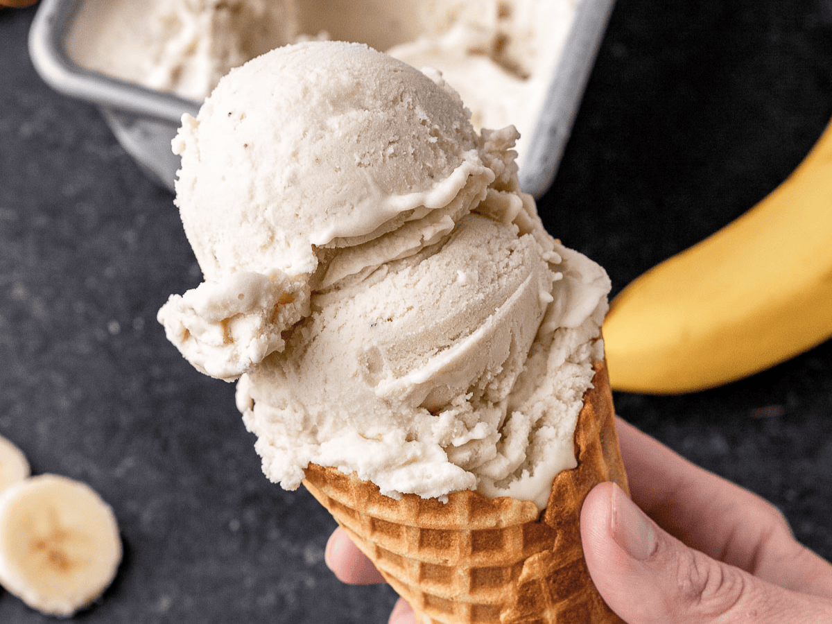 Two scoops of ice cream in cone.