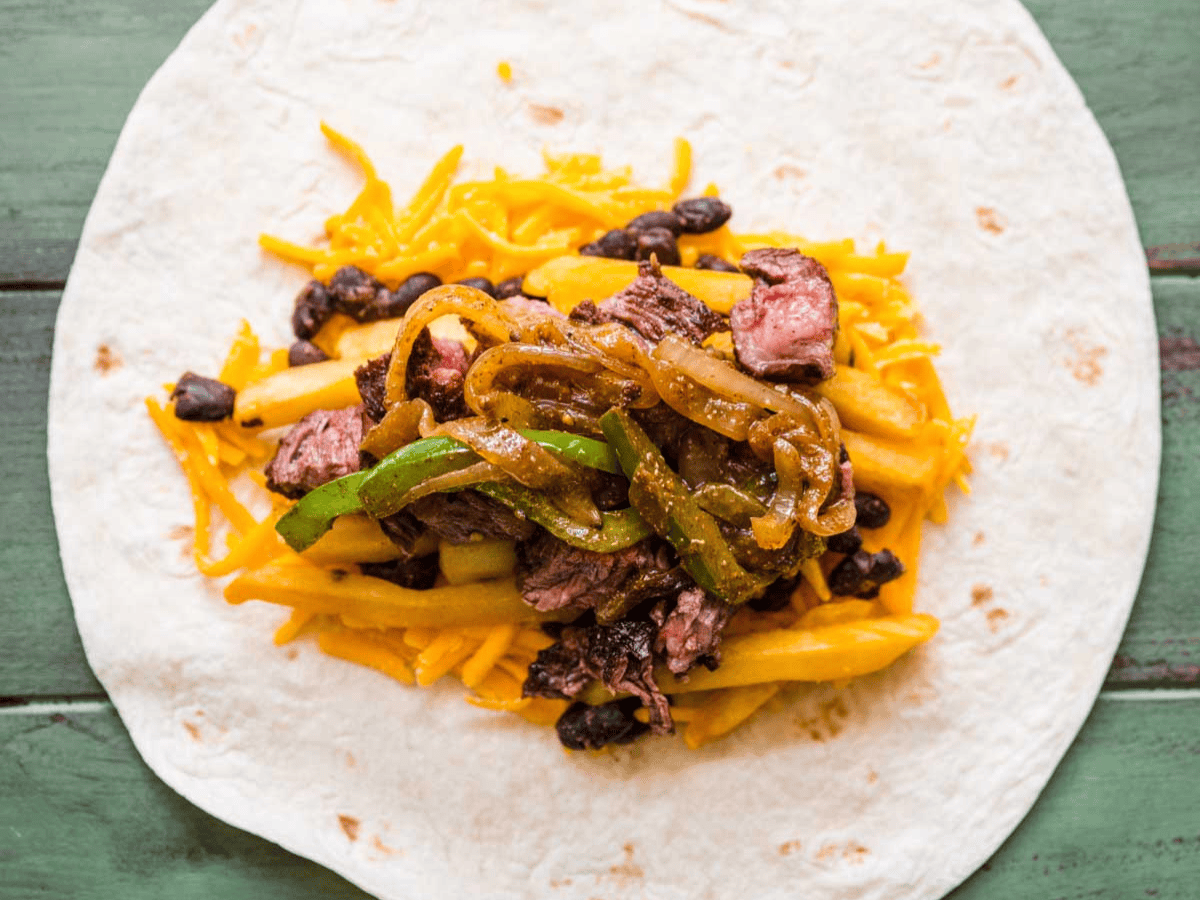 Toppings placed in the middle of a flour tortilla.