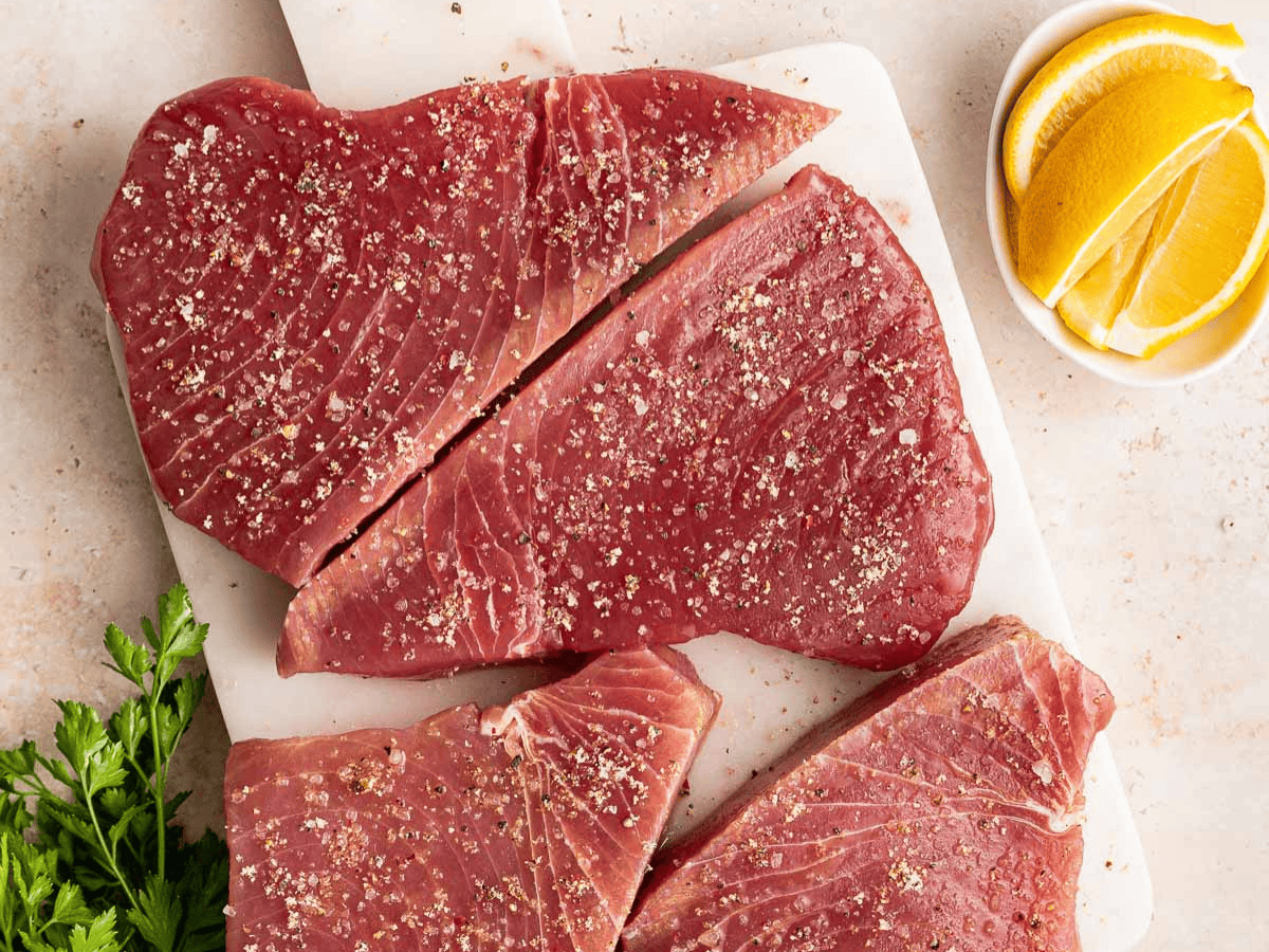 Seasoned raw fish fillets.