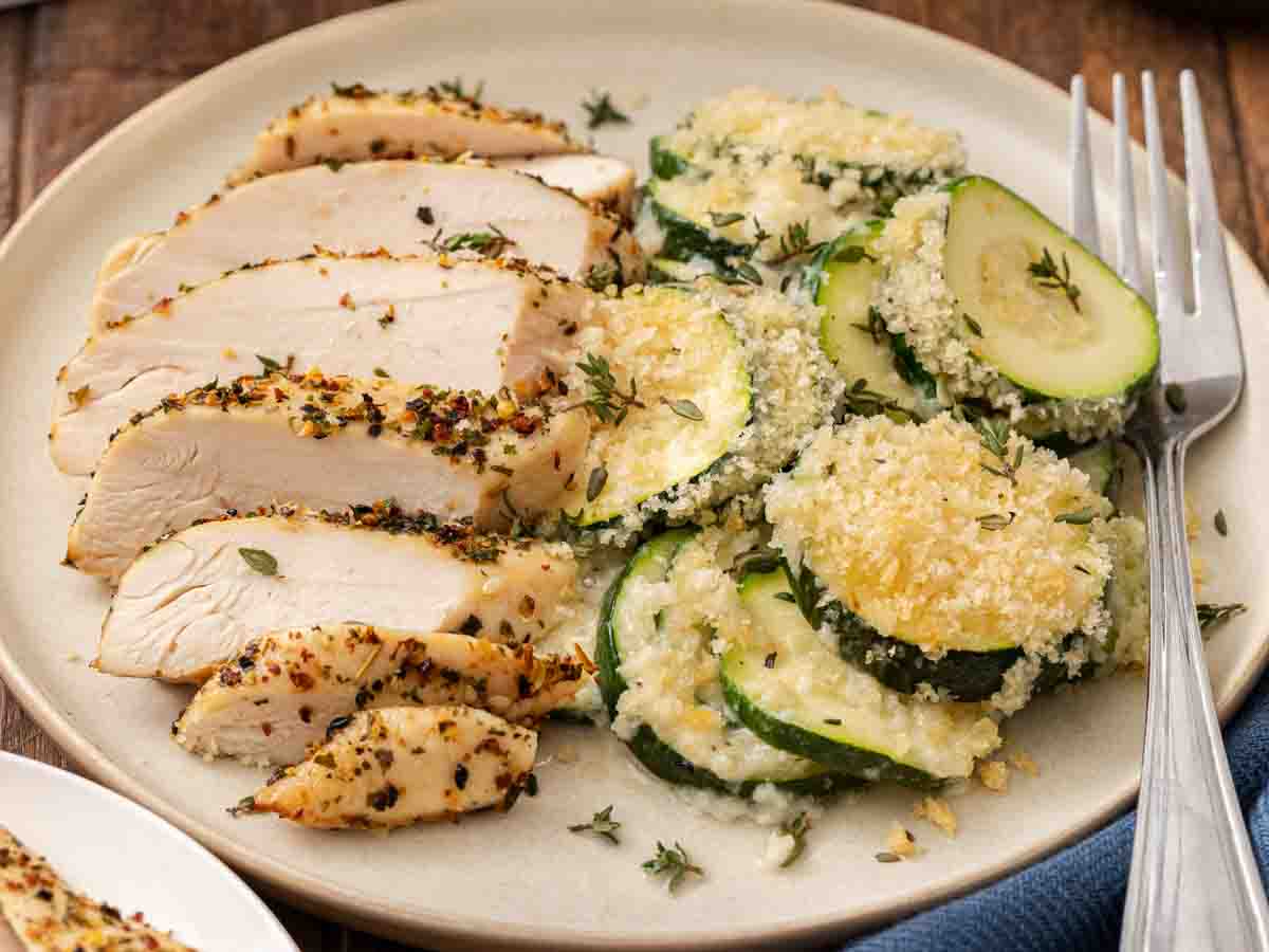 Dinner plate with vegetable casserole and chicken breast.