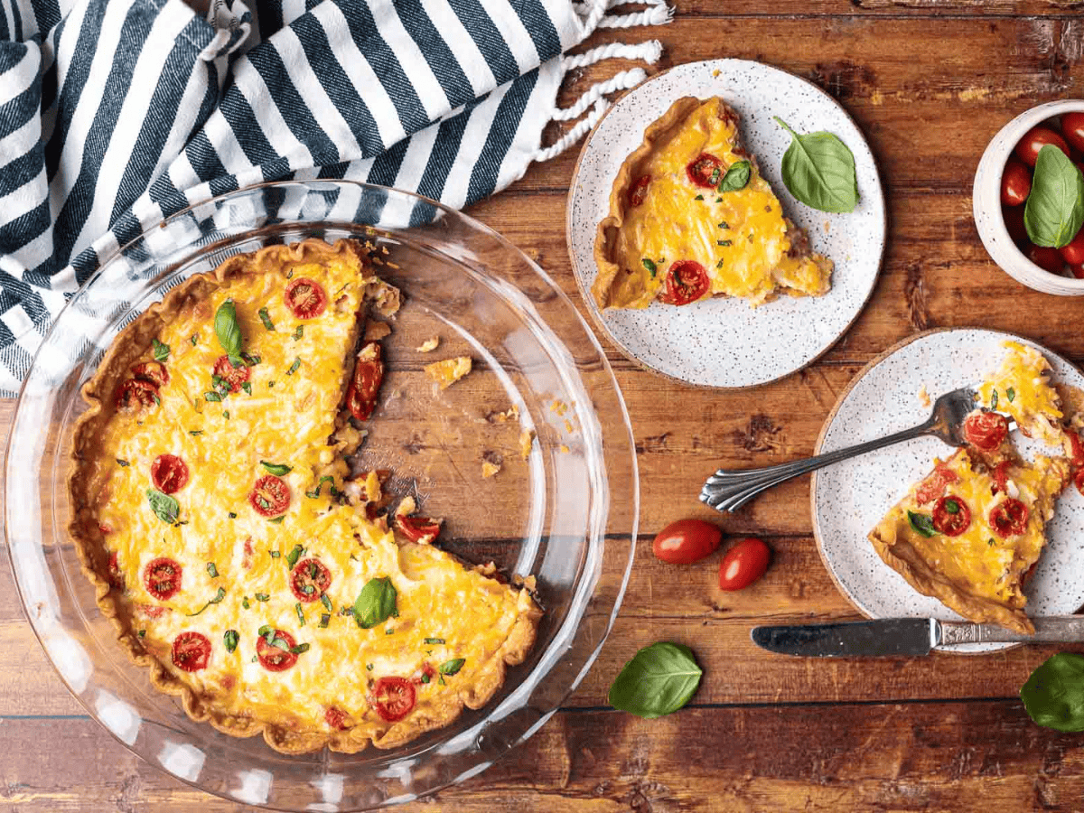 Cooked savory pie with 2 slices cut out of the pie dish.