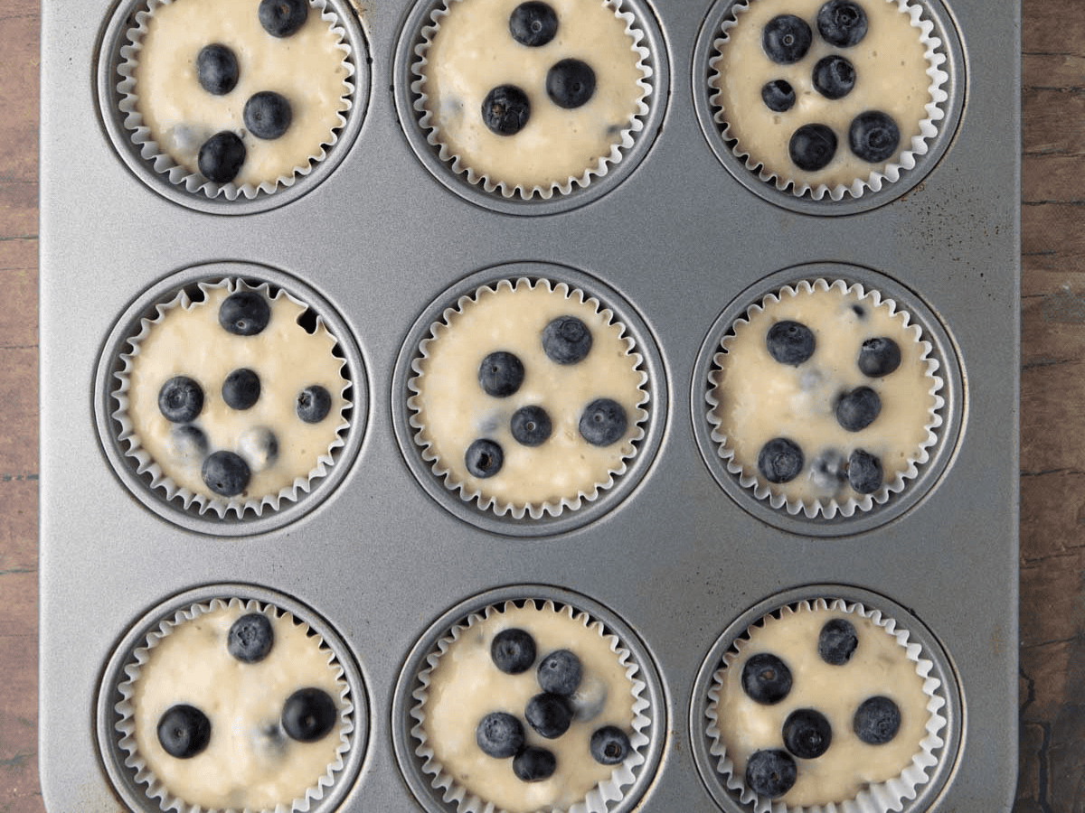 Muffin batter in baking tin.