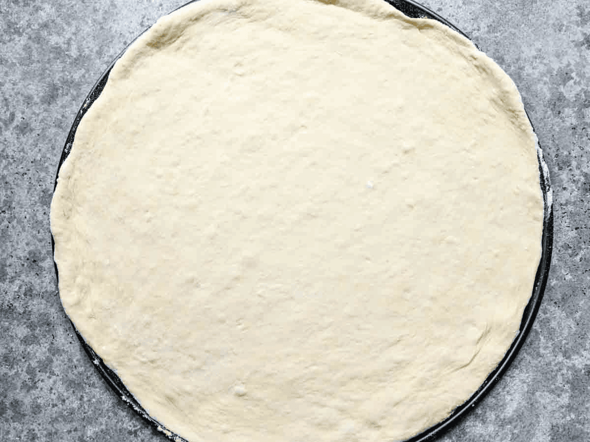 Rolled out pizza dough.