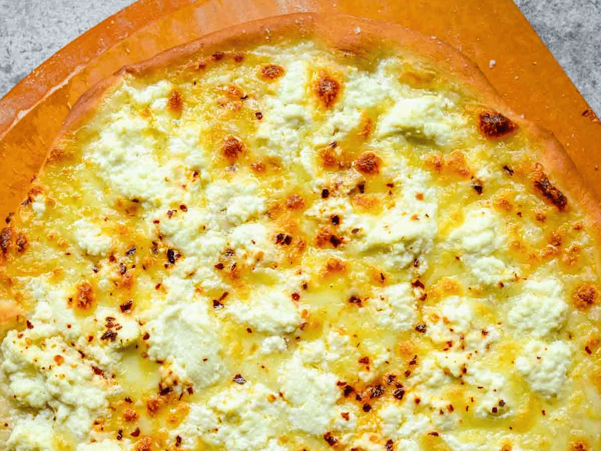 Baked pizza with cheese topping.
